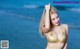 Atittaya Chaiyasing beauty poses hot on the beach with a yellow bikini (41 photos)